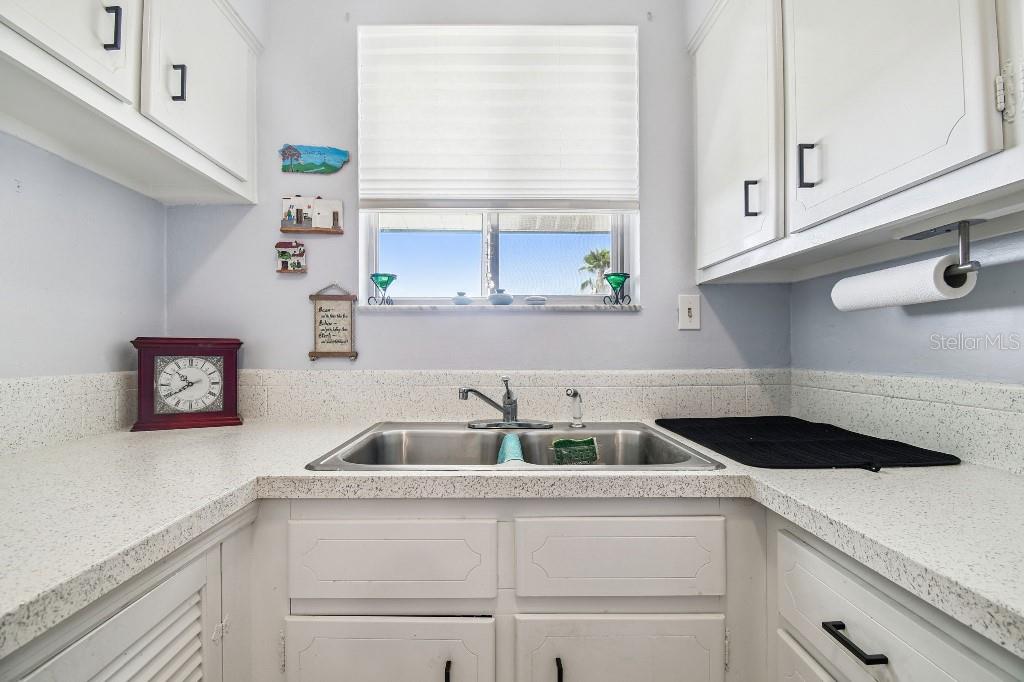 1600 West Lake Parker Drive, Unit B22 Lakeland, FL 33805 - Photo 11 of 26 a kitchen with a sink and cabinets