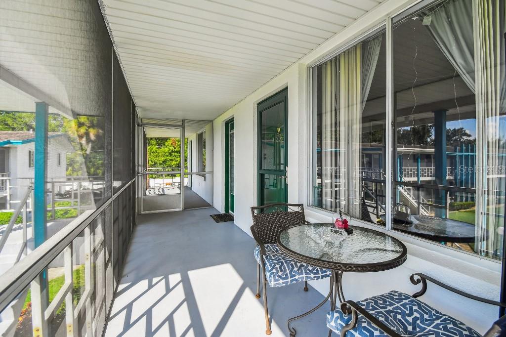 1600 West Lake Parker Drive, Unit B22 Lakeland, FL 33805 - Photo 2 of 26 a backyard of a house with table and chairs