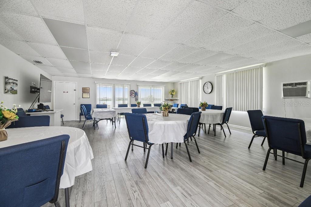 1600 West Lake Parker Drive, Unit B22 Lakeland, FL 33805 - Photo 21 of 26 a view of a dining room with furniture and wooden floor