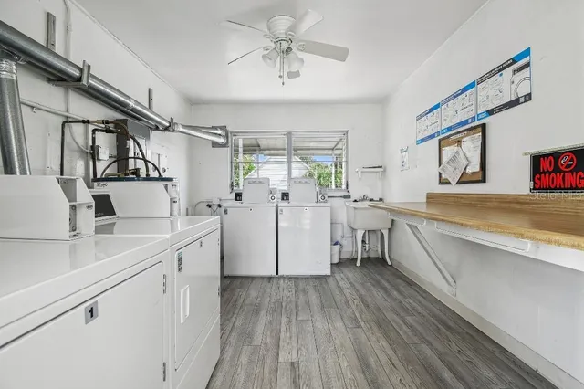 a kitchen with cabinets a sink and appliances