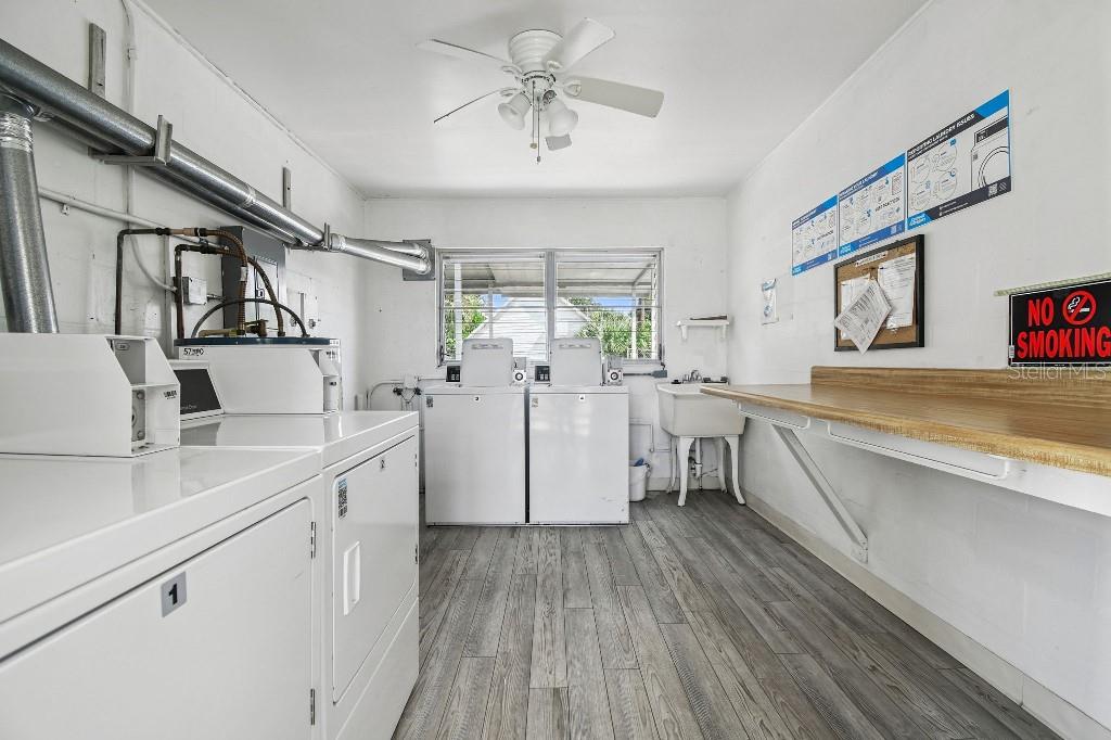 1600 West Lake Parker Drive, Unit B22 Lakeland, FL 33805 - Photo 22 of 26 a kitchen with cabinets a sink and appliances