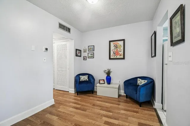a view of livingroom with furniture and natural light