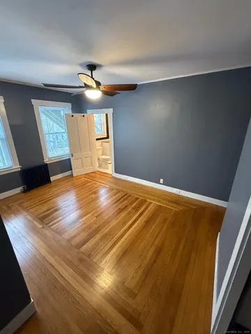 a bathroom with a sink mirror and toilet