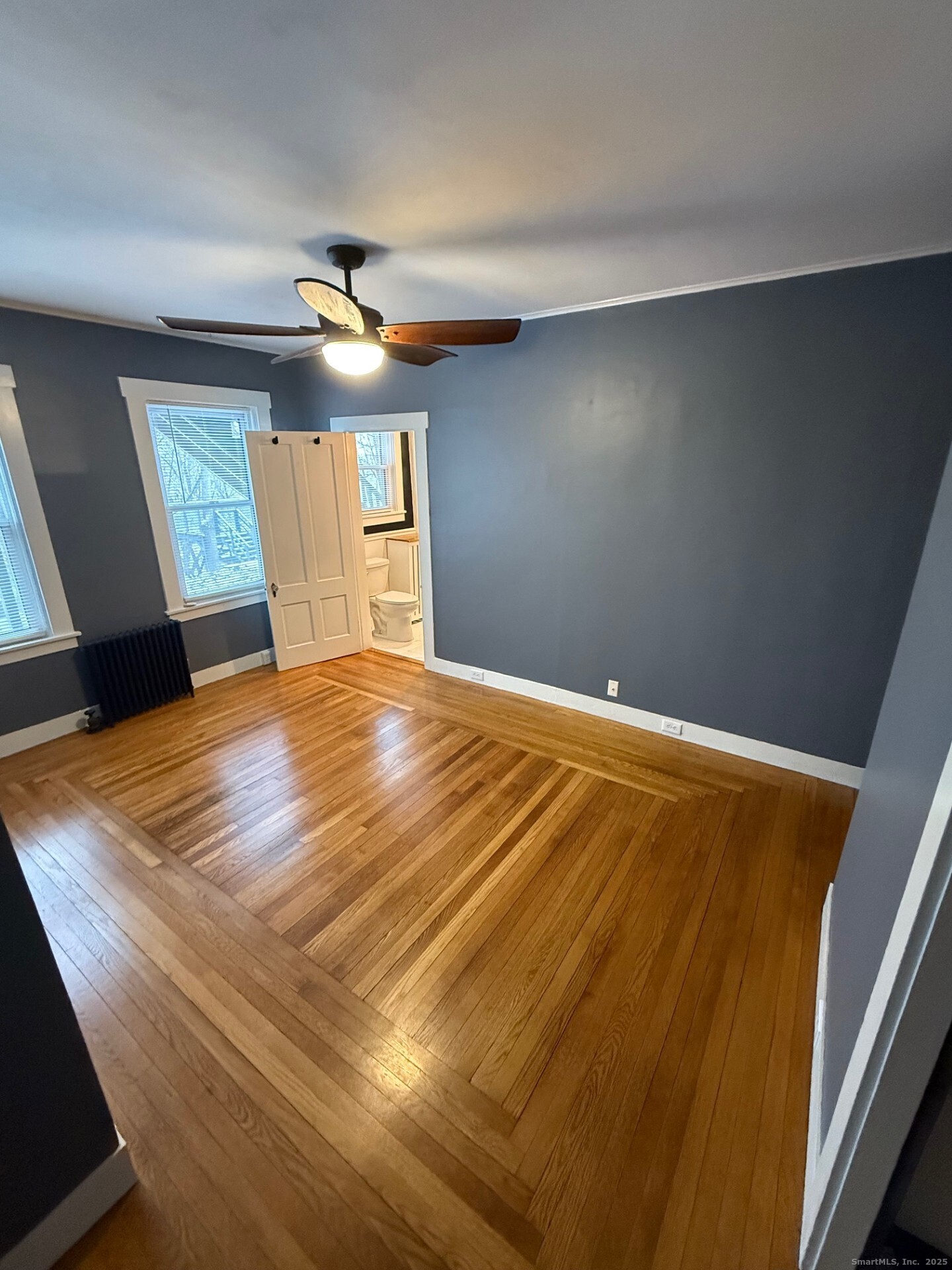 16 Wilkinson Street Putnam, CT 06260 - Photo 14 of 35 a bedroom with a bed and a chandelier