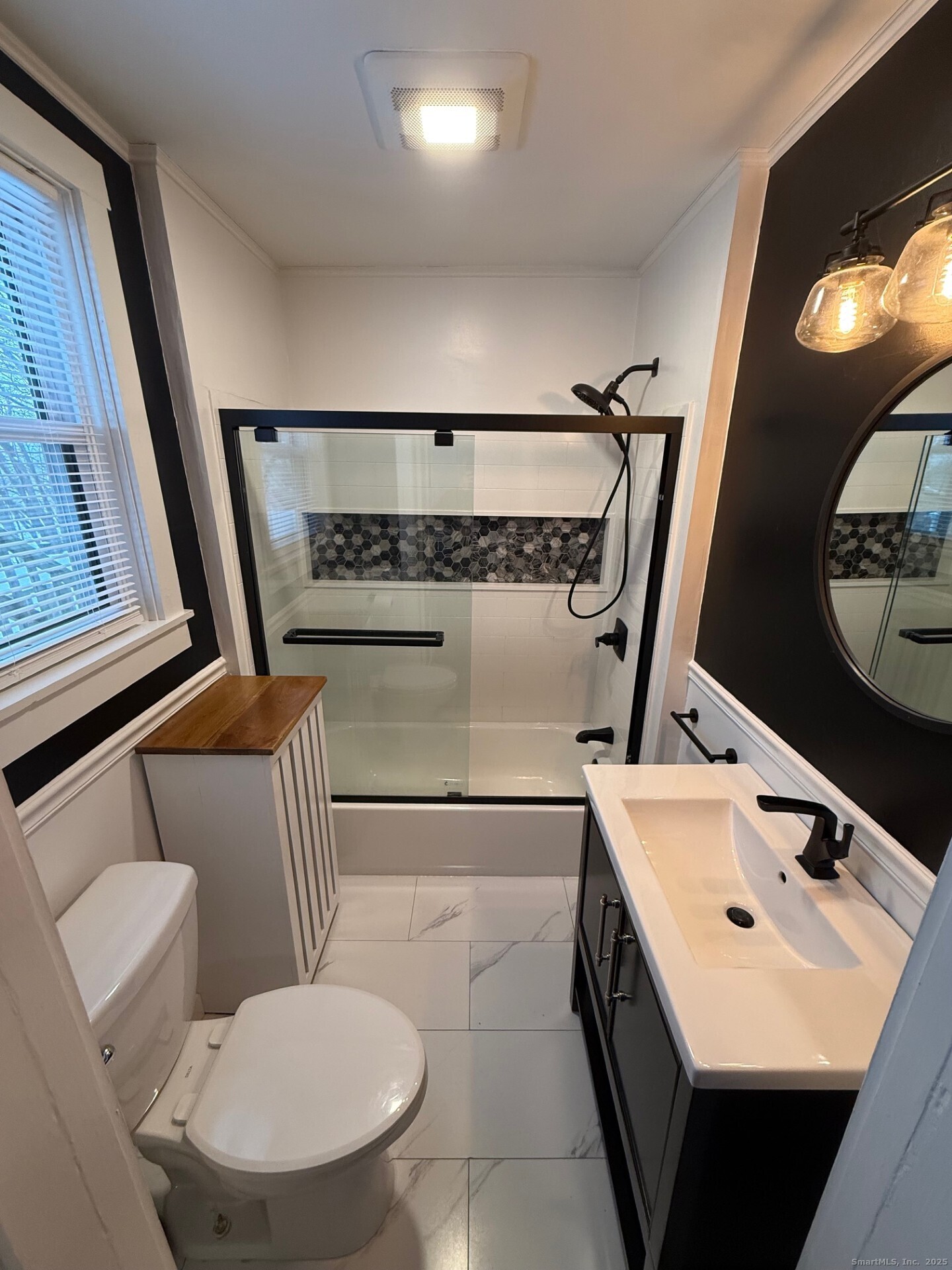 16 Wilkinson Street Putnam, CT 06260 - Photo 15 of 35 a bathroom with a sink mirror and toilet