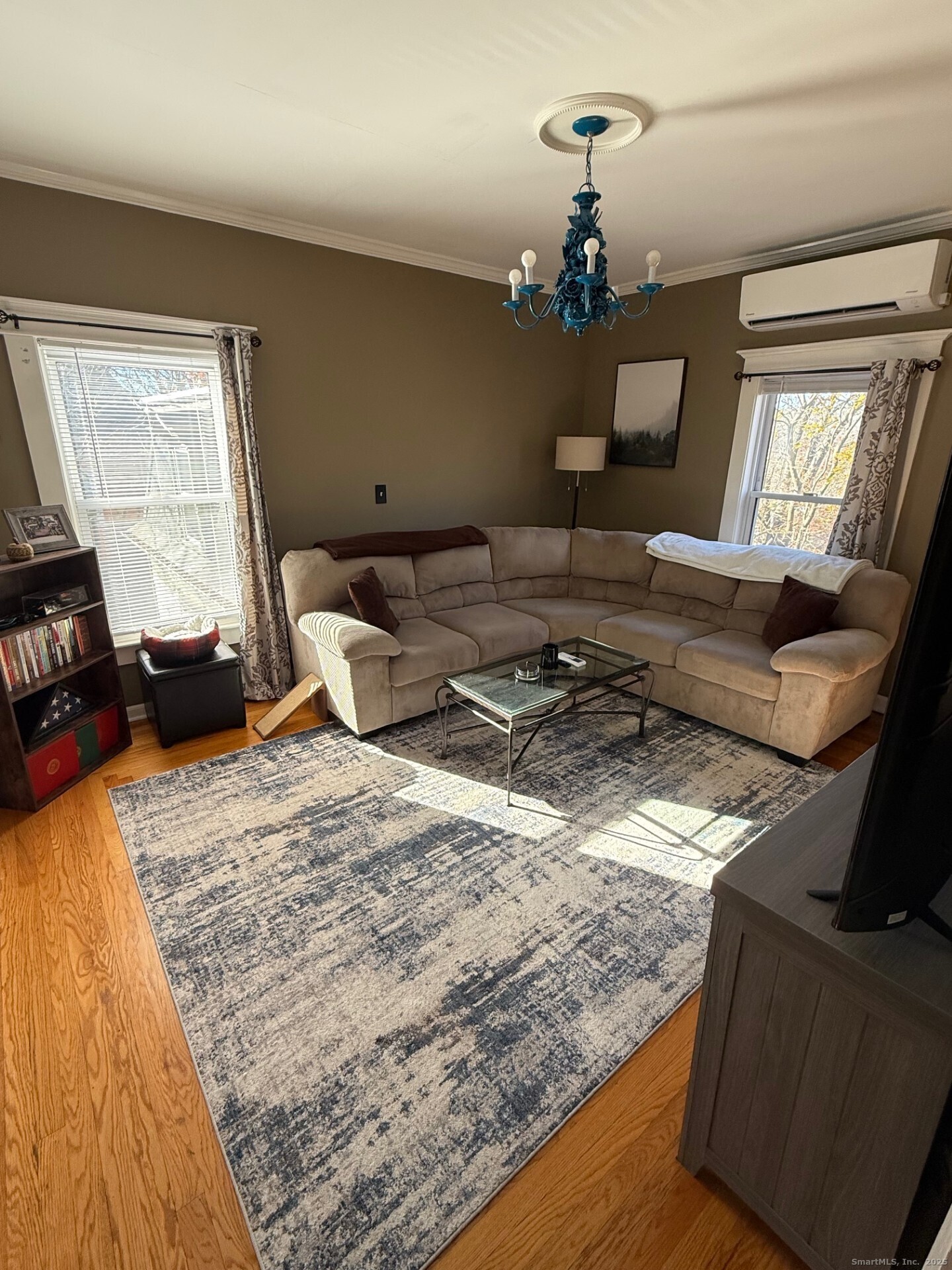 16 Wilkinson Street Putnam, CT 06260 - Photo 20 of 35 a living room with furniture and a chandelier