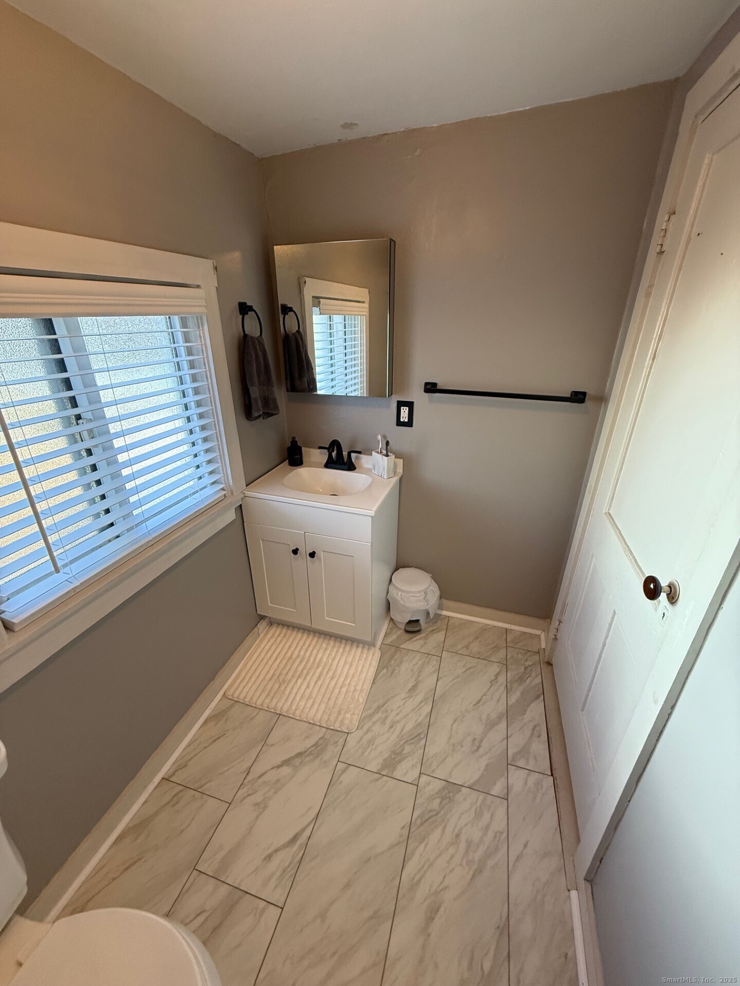 16 Wilkinson Street Putnam, CT 06260 - Photo 24 of 35 a bedroom with a bed and a large window