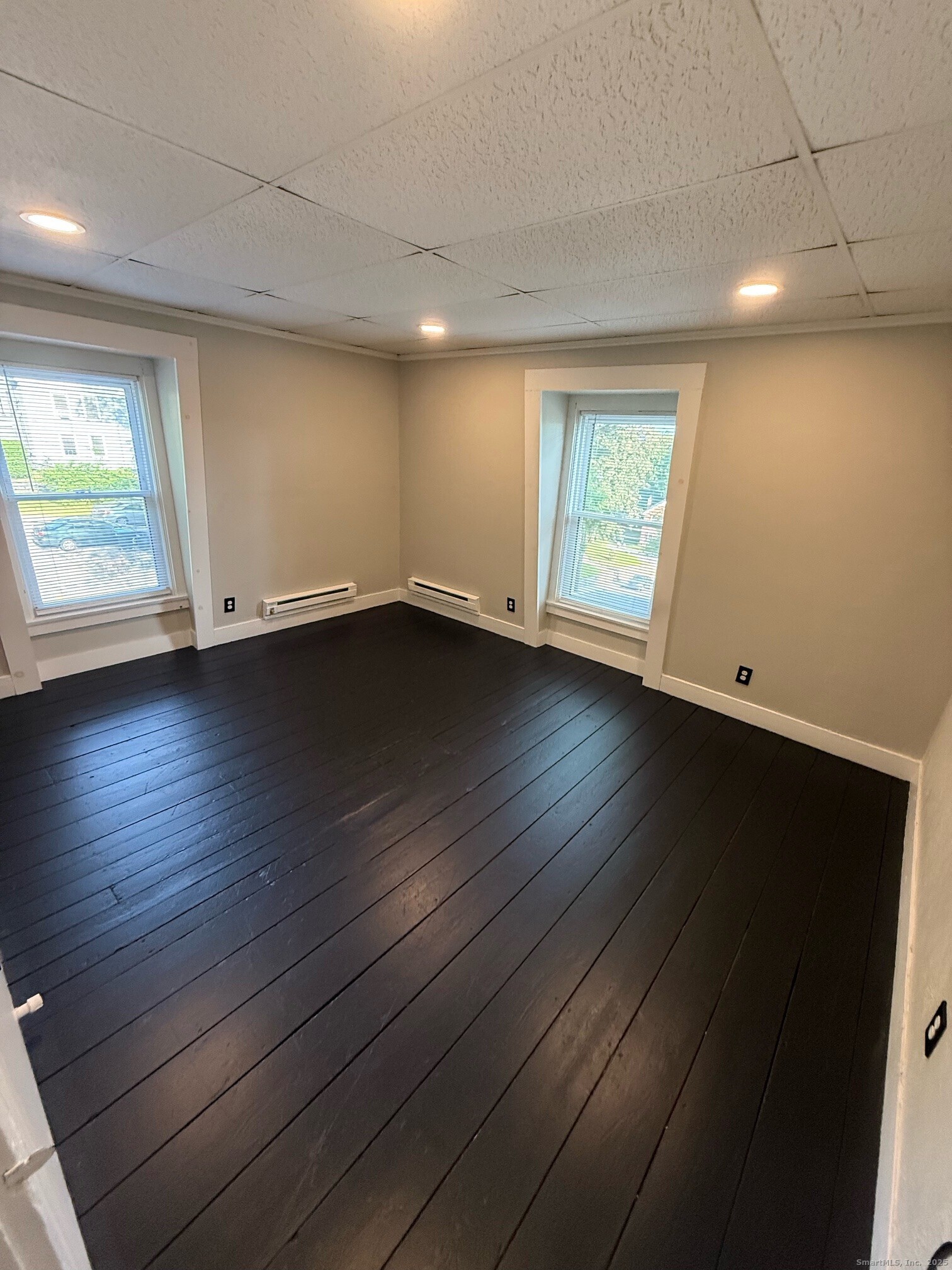 16 Wilkinson Street Putnam, CT 06260 - Photo 31 of 35 an empty room with wooden floor and windows