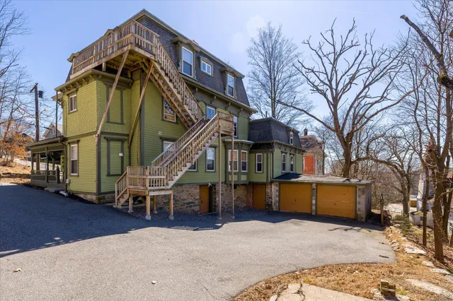 a view of a house with a snow in a yard