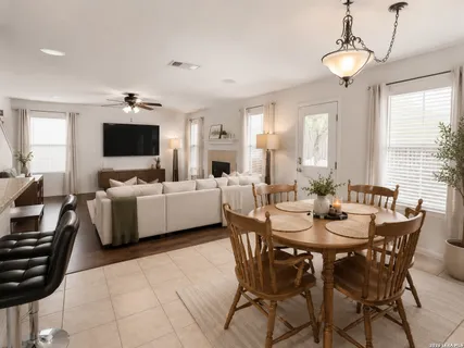 a view of a dining room with furniture and windows