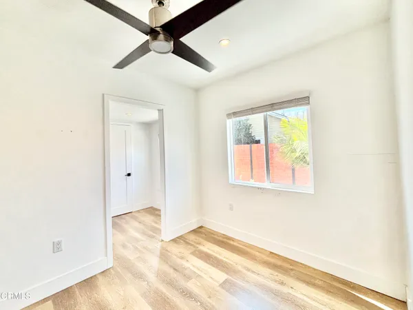 a view of a livingroom with furniture and a window