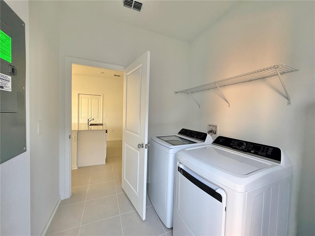 2348 Rider Rain Lane Apopka, FL 32703 - Photo 12 of 32 a utility room with washer and dryer