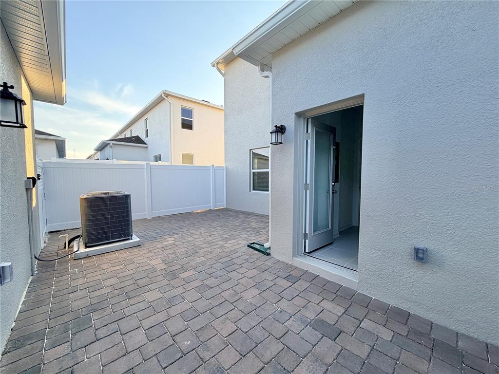 2348 Rider Rain Lane Apopka, FL 32703 - Photo 13 of 32 a view of a house with a yard and seating space