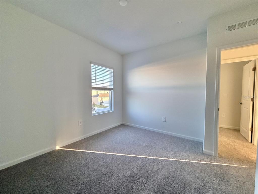 2348 Rider Rain Lane Apopka, FL 32703 - Photo 20 of 32 an empty room with windows