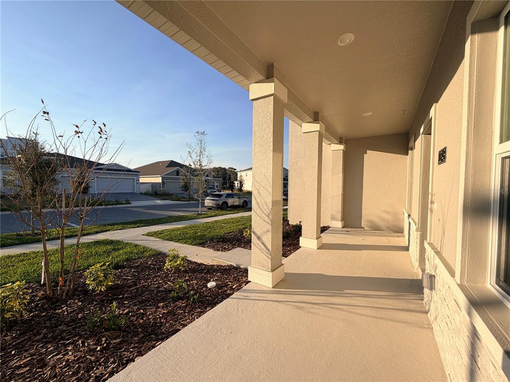 2348 Rider Rain Lane Apopka, FL 32703 - Photo 2 of 32 a view of a swimming pool with a chair and floor to ceiling window