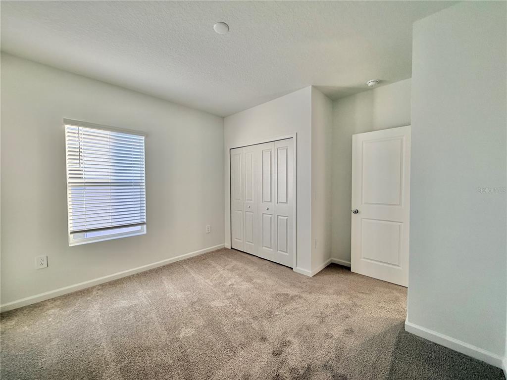 2348 Rider Rain Lane Apopka, FL 32703 - Photo 25 of 32 a view of an empty room with a window