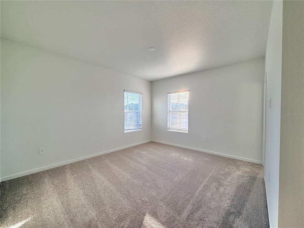 2348 Rider Rain Lane Apopka, FL 32703 - Photo 26 of 32 an empty room with windows