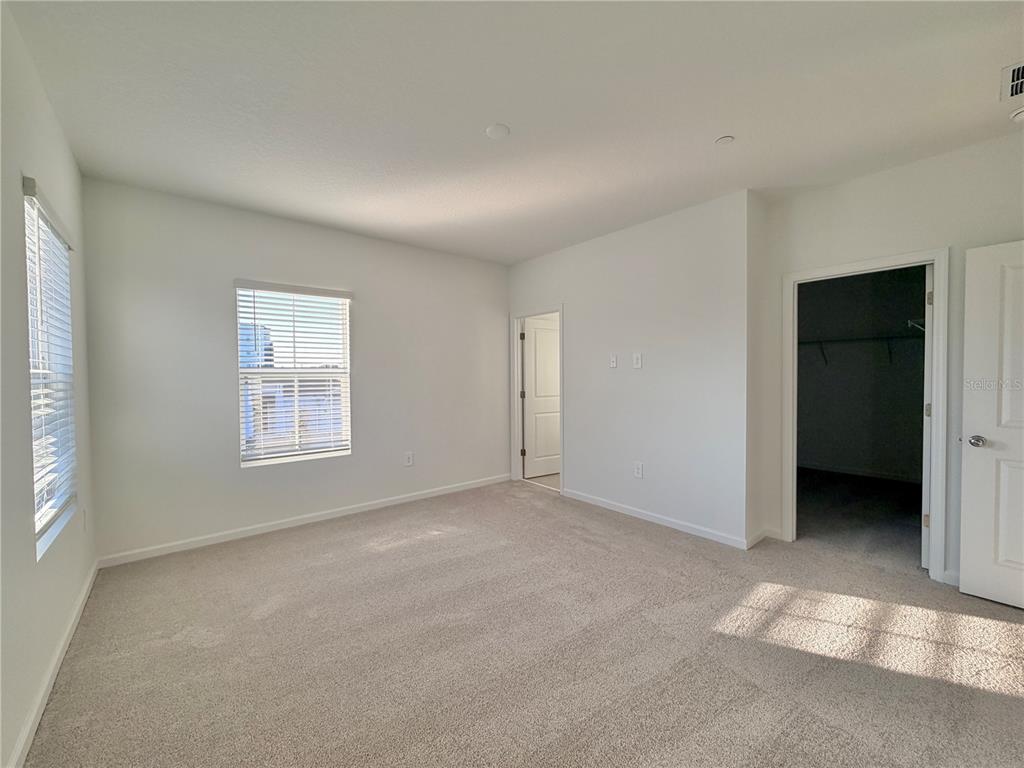 2348 Rider Rain Lane Apopka, FL 32703 - Photo 27 of 32 an empty room with windows