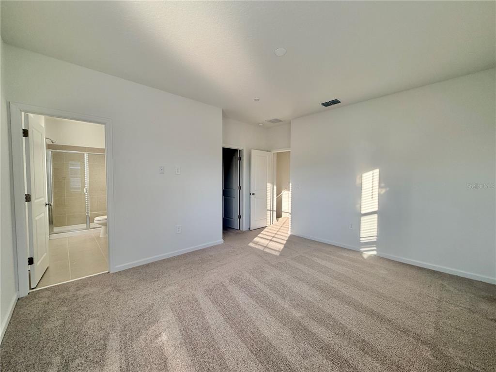 2348 Rider Rain Lane Apopka, FL 32703 - Photo 28 of 32 wooden floor in an empty room