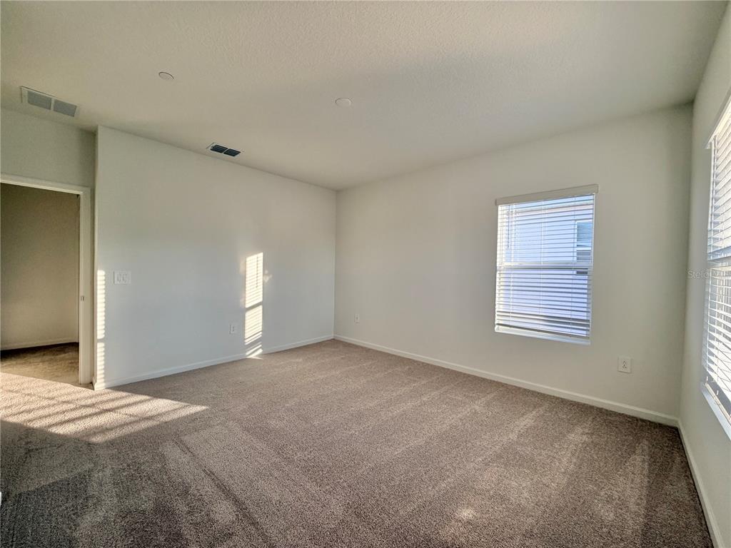 2348 Rider Rain Lane Apopka, FL 32703 - Photo 31 of 32 a view of an empty room with a window