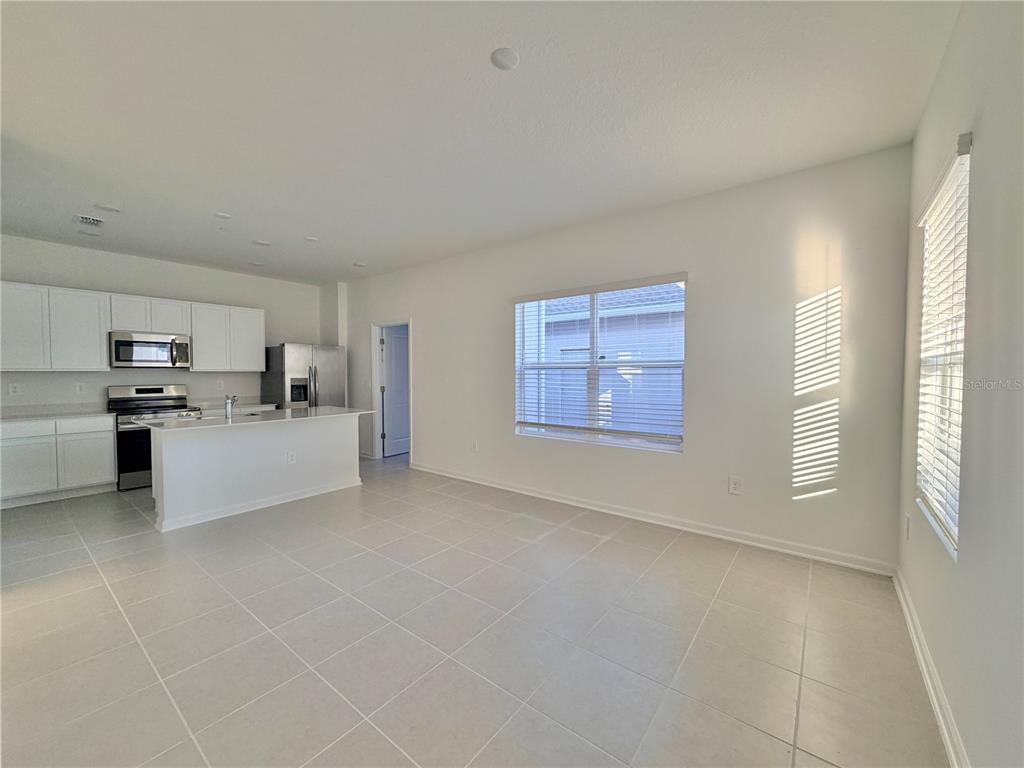 2348 Rider Rain Lane Apopka, FL 32703 - Photo 8 of 32 a view of kitchen with furniture and cabinets