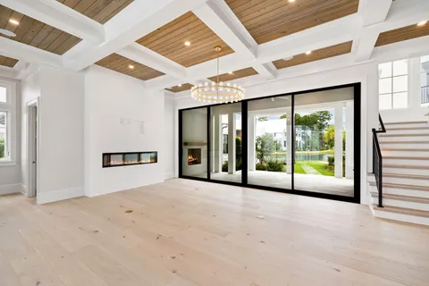a view of a livingroom with a fireplace and window