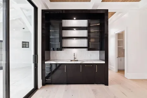 a white tub sitting in a bathroom next to a window