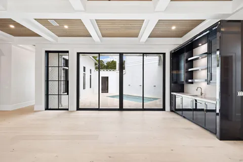 a view of kitchen with wooden floor and windows