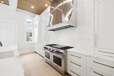 a bathroom with a shower sink and mirror