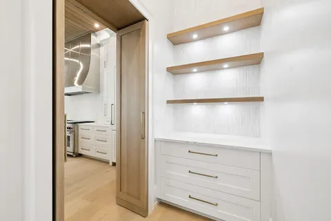 an empty room with windows and entrance