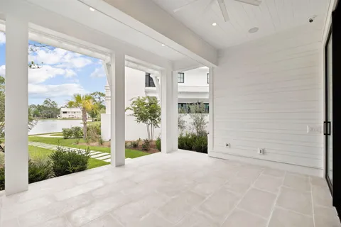an aerial view of residential house with outdoor space and seating