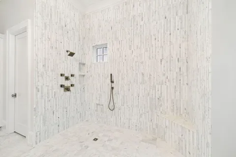 a view of a kitchen with an empty space and wooden floor