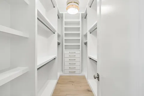 a view of a house with swimming pool and sitting area