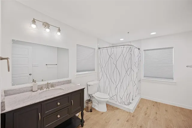 a bedroom with a bed window and a couch