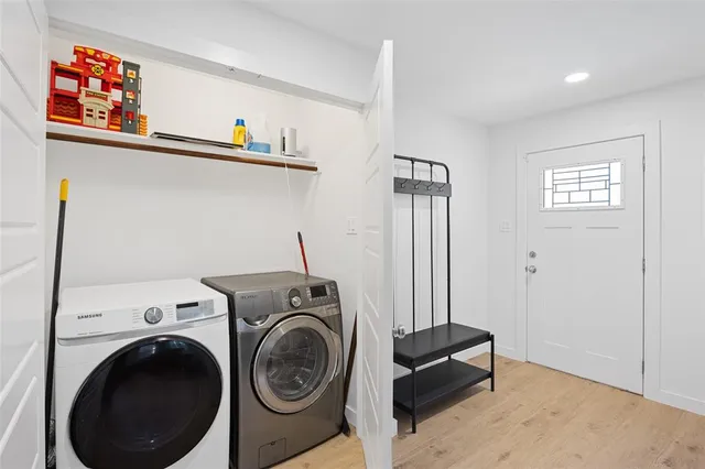a bathroom with double vanity sinks and a mirror