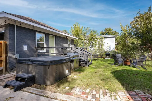 a view of a house with backyard porch and sitting area