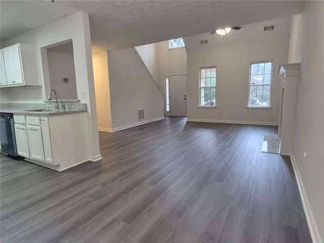 a view of a kitchen cabinets and wooden floor