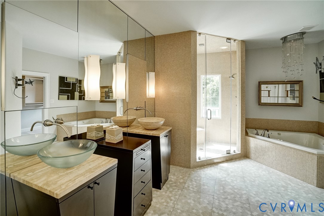 721 Meadow View Ridge Manakin-Sabot, VA 23103 - Photo 22 of 45 a spacious bathroom with a granite countertop sink and a mirror