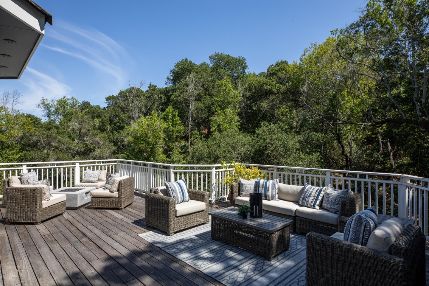 345 Harcross Road Woodside, CA 94062 - Photo 31 of 37 a balcony with wooden floor and outdoor seating