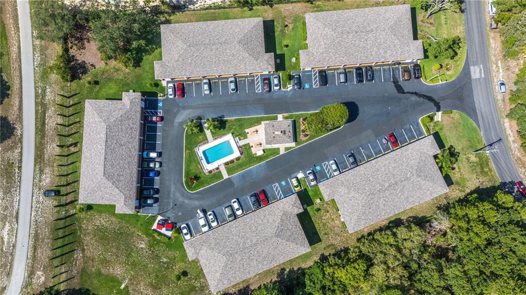 4150 Portillo Road, Unit 5 Spring Hill, FL 34608 - Photo 1 of 25 aerial view of a chairs and table in front of a house