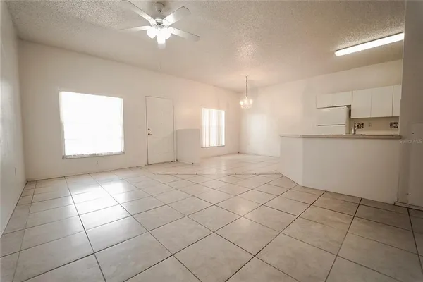 a view of a kitchen with a sink and cabinets
