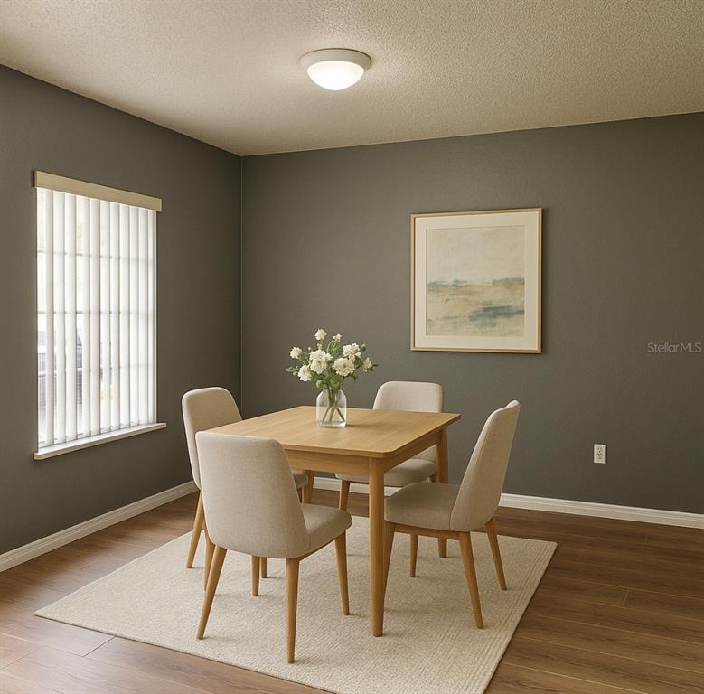 4150 Portillo Road, Unit 5 Spring Hill, FL 34608 - Photo 14 of 43 a dining room with furniture and window