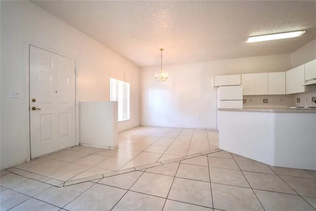 a view of a kitchen with a sink and cabinets