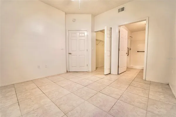 an empty room with a bathroom
