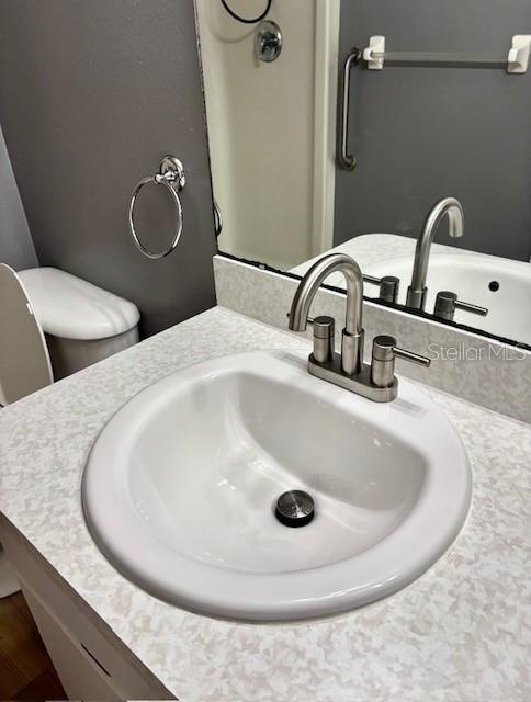 4150 Portillo Road, Unit 5 Spring Hill, FL 34608 - Photo 33 of 43 a bathroom with a sink and mirror