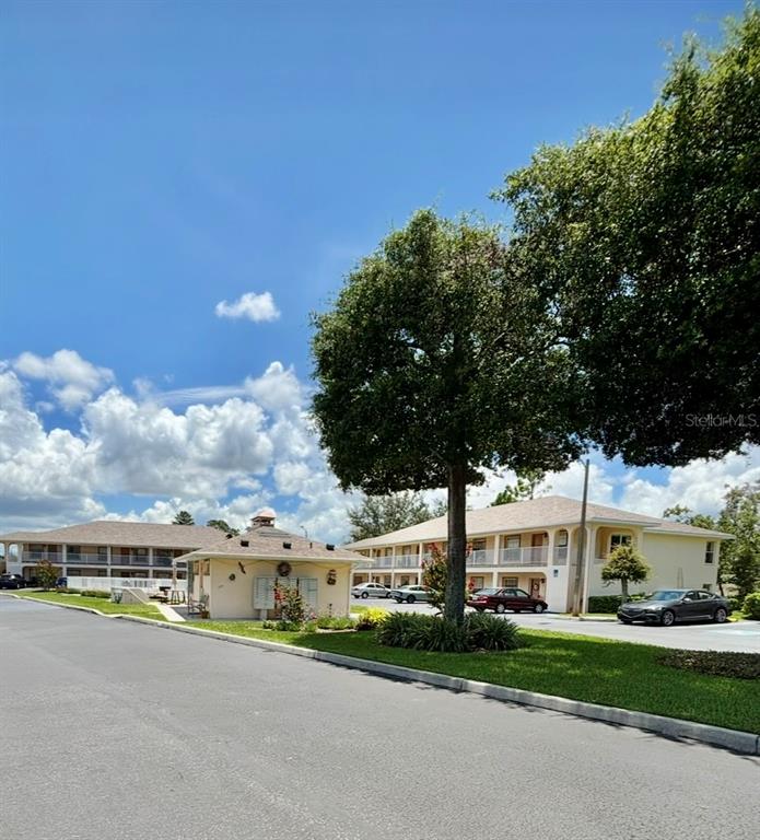 4150 Portillo Road, Unit 5 Spring Hill, FL 34608 - Photo 5 of 25 a city view with tall buildings and a big yard