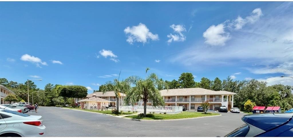 4150 Portillo Road, Unit 5 Spring Hill, FL 34608 - Photo 6 of 25 a view of a street with cars parked