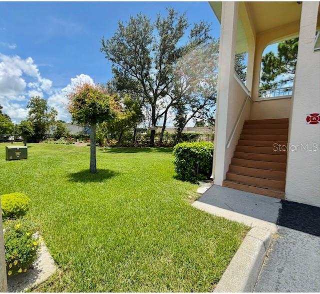 4150 Portillo Road, Unit 5 Spring Hill, FL 34608 - Photo 8 of 25 a view of a yard with plants and a fountain