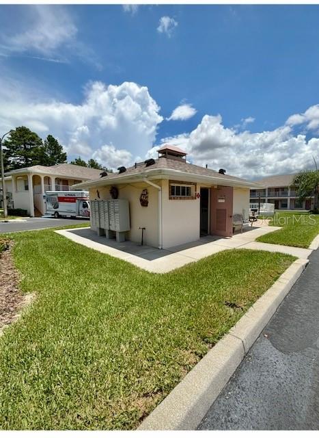 4150 Portillo Road, Unit 5 Spring Hill, FL 34608 - Photo 9 of 25 a view of house with outdoor space and sitting area