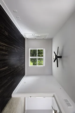 a bathroom with a bathtub and a window